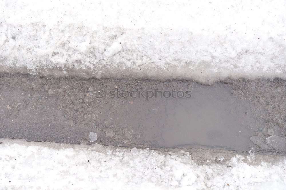 Similar – Schneeschieber, viel Schnee und Kopfsteinpflaster