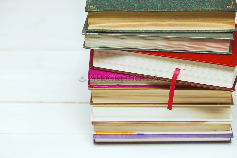 Similar – Image, Stock Photo Young girl turning the pages of book in bookstore