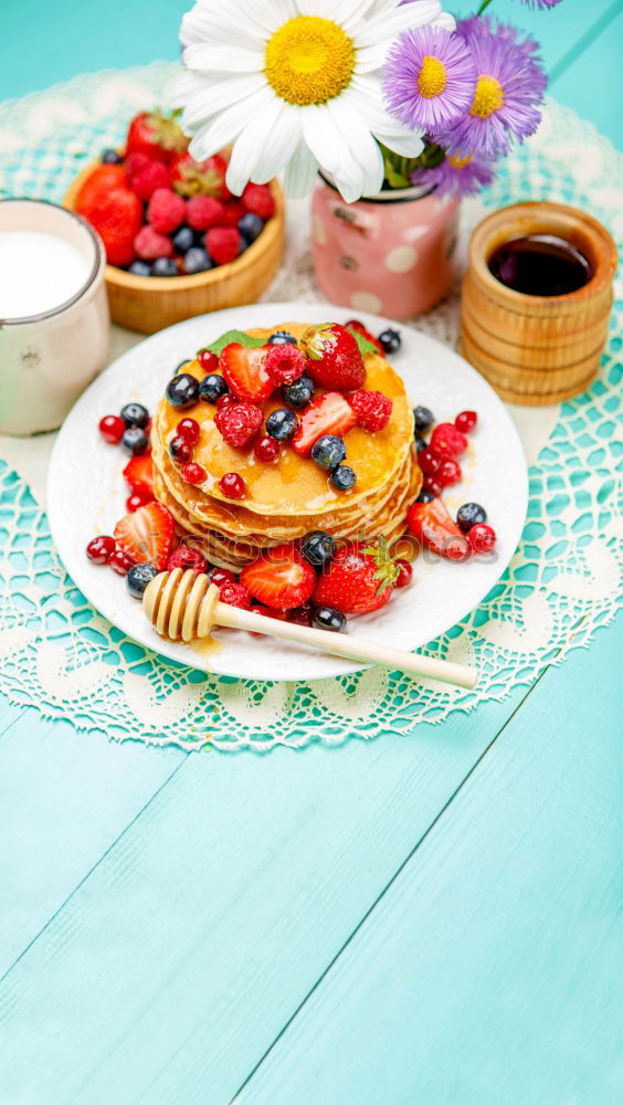 Tasty pancakes with strawberries