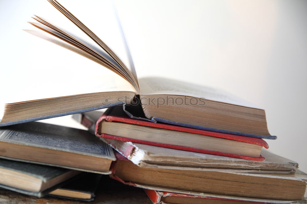 Similar – Image, Stock Photo A few old books on wooden table in antique bookstore