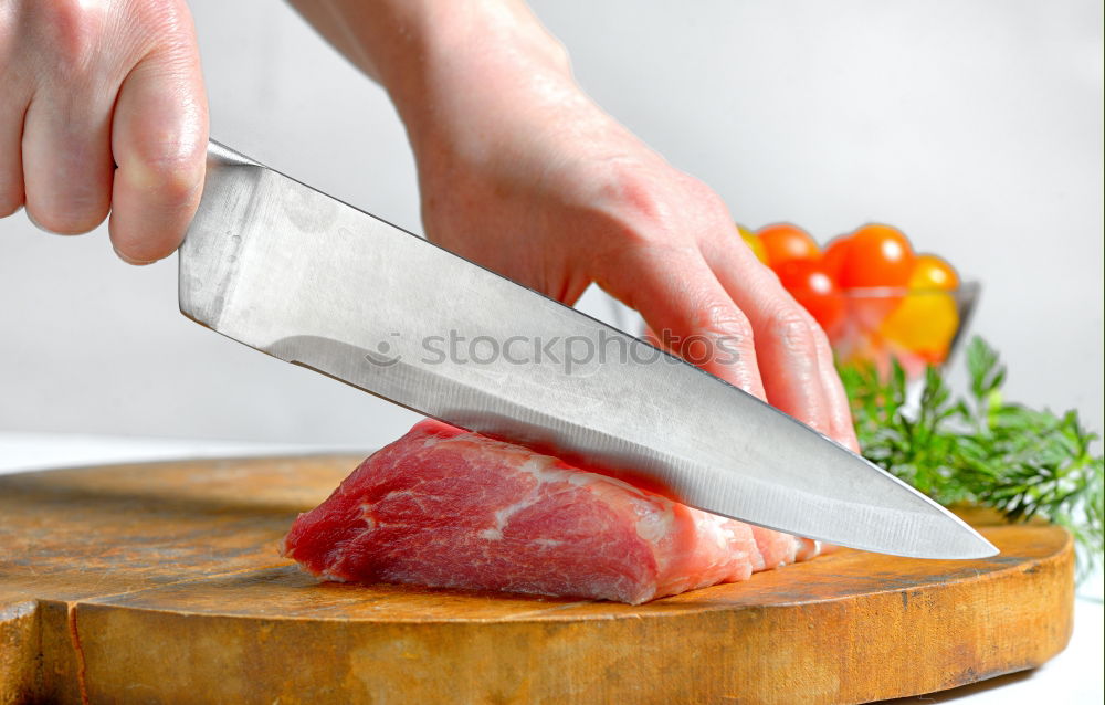 Similar – Image, Stock Photo Cutter carving slices from a whole bone-in serrano ham