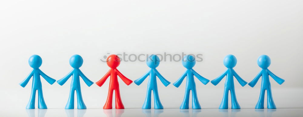 Similar – Image, Stock Photo Single figure between two groups in different colors