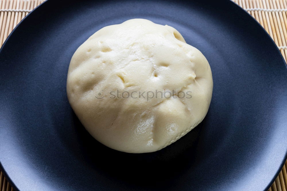 Similar – Meringue with cracks in old bowls