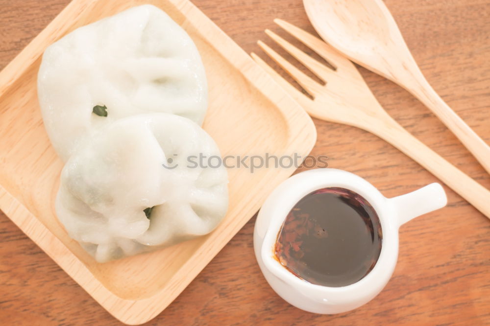 Similar – Dumplings or gyoza served in traditional steamer