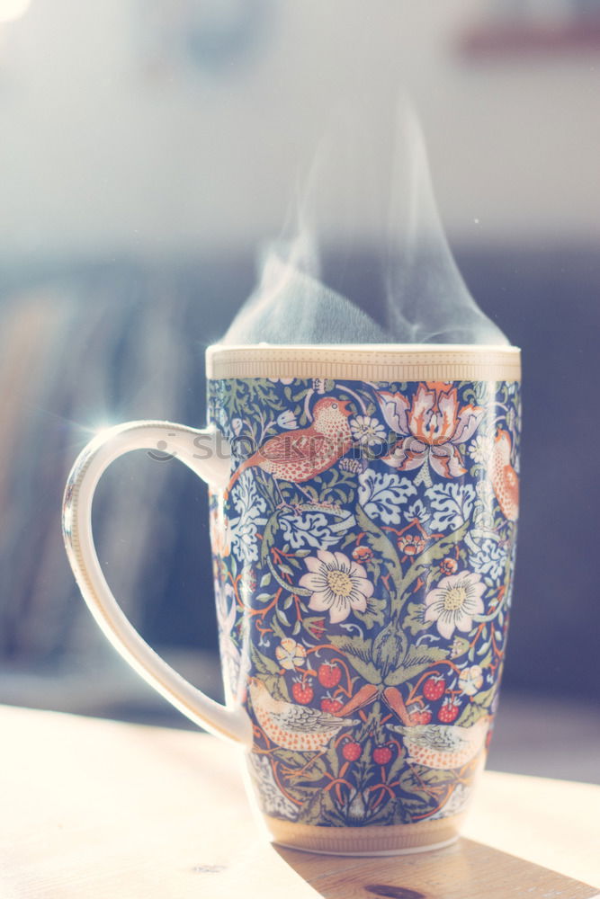 Similar – A painted ceramic milk jug next to an empty white cup