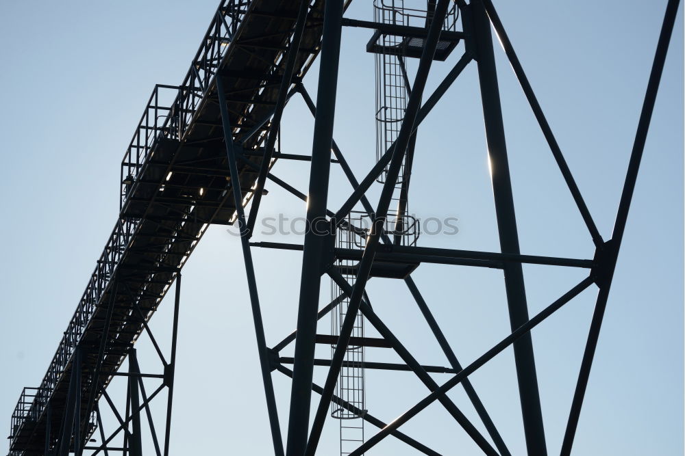 Similar – Power pole from the inside from the frog’s perspective in front of a blue sky