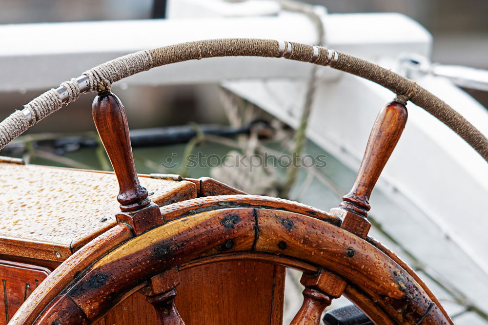 Similar – Steering wheel of a sailing ship