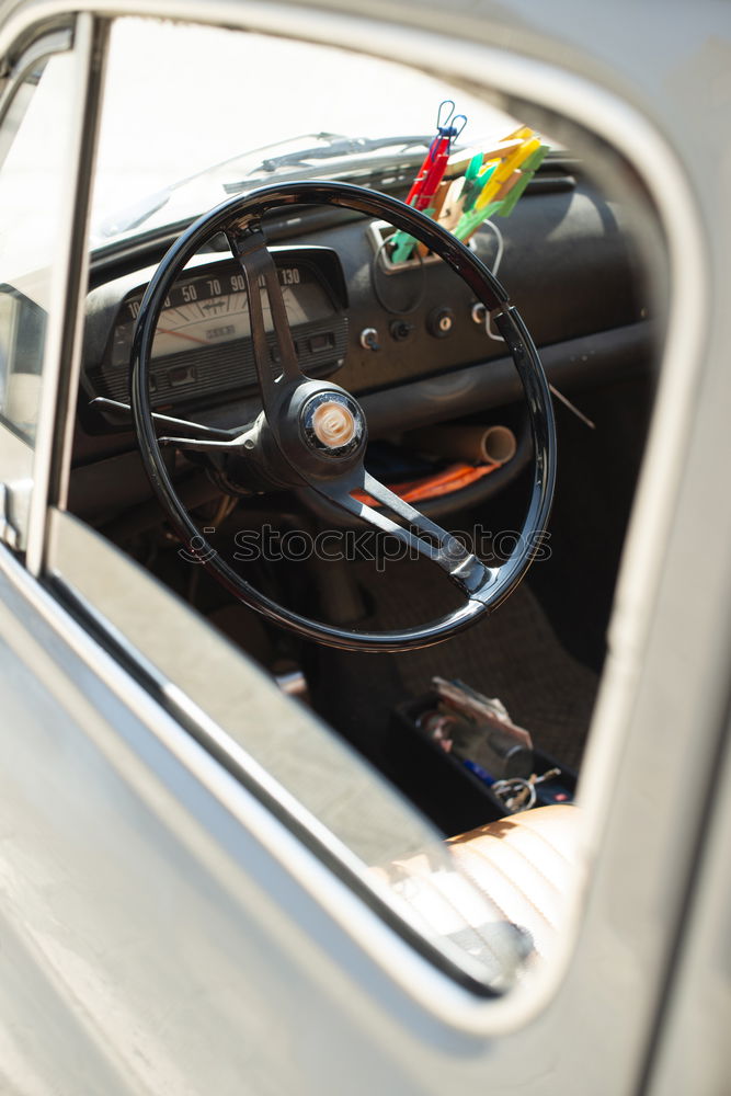 Man sleeping in vintage car