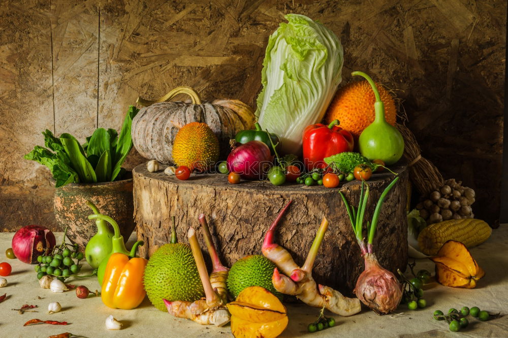 Similar – Image, Stock Photo Pumpkin and autumn vegetables on the kitchen table