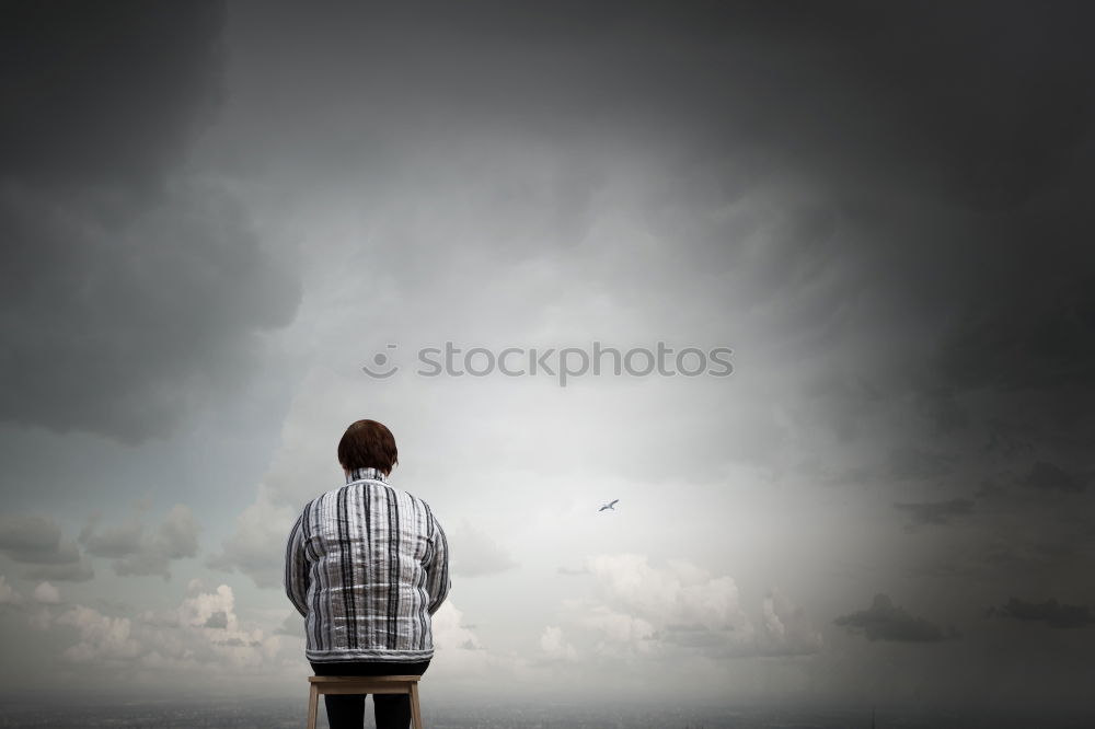 Similar – Man exhausted from a hike at a viewpoint