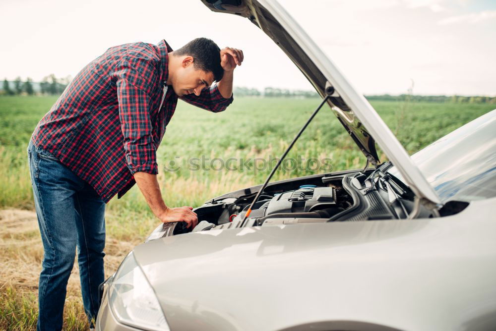 Similar – Image, Stock Photo man looks at the motor broken machine