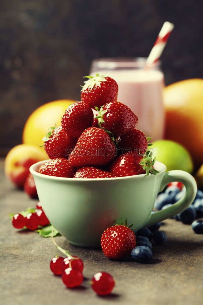 Similar – Fresh yogurt with fruits and muesli on breakfast