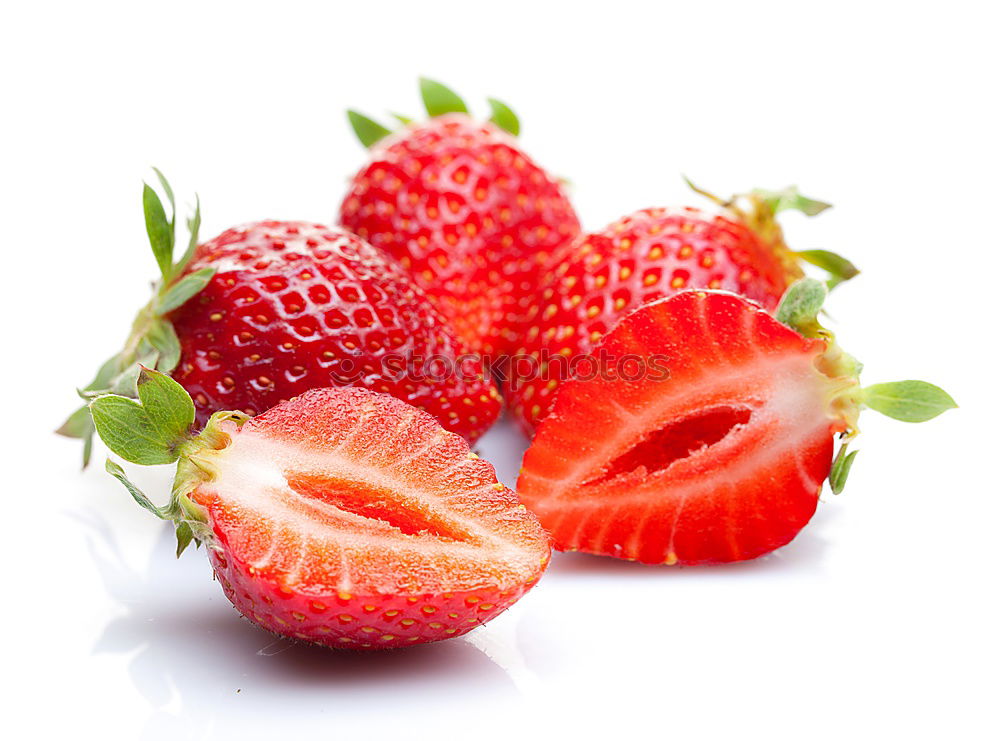 Similar – Strawberries whole and cut on a white wooden table