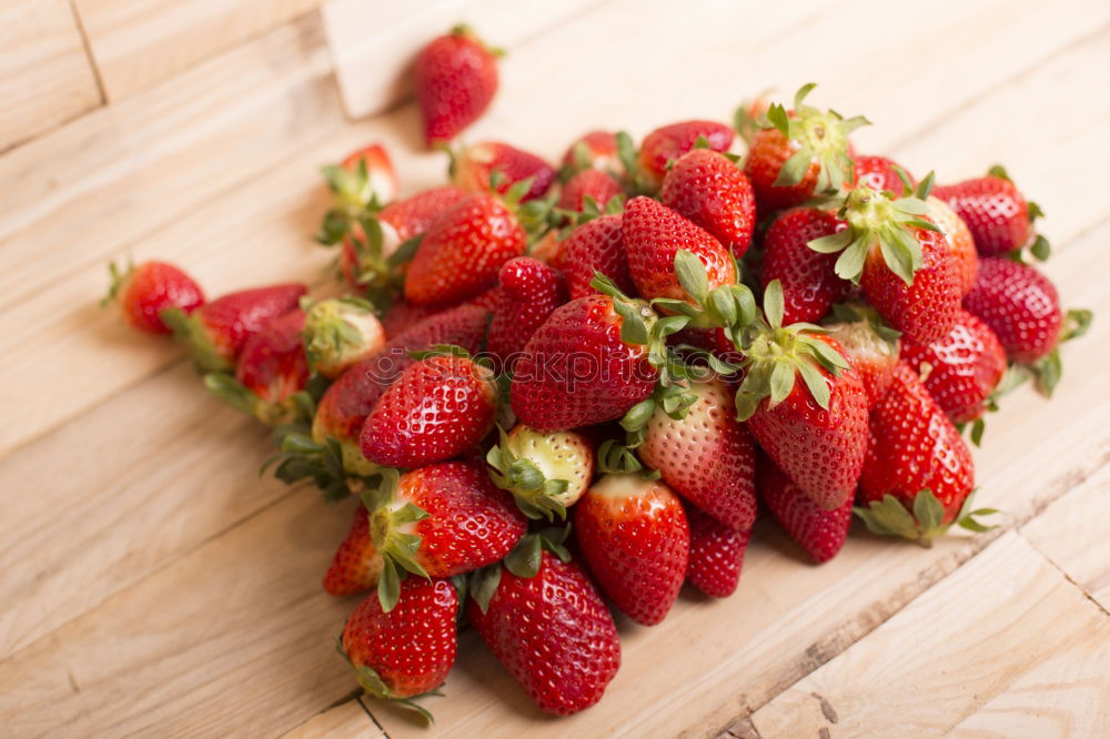 Similar – Strawberries close up on a white wooden table