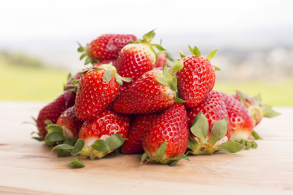 Similar – Strawberries on a wooden board with empty space