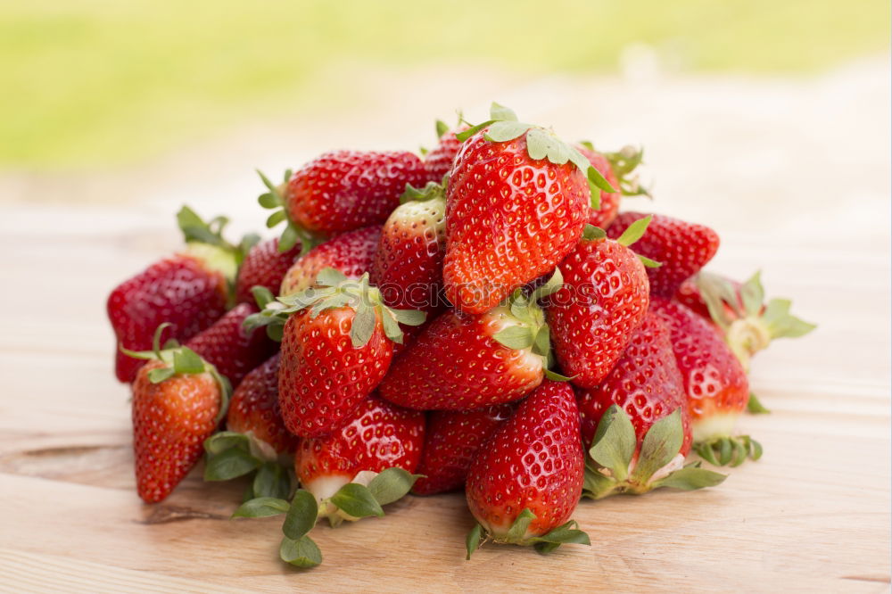 Similar – Strawberries close up on a white wooden table