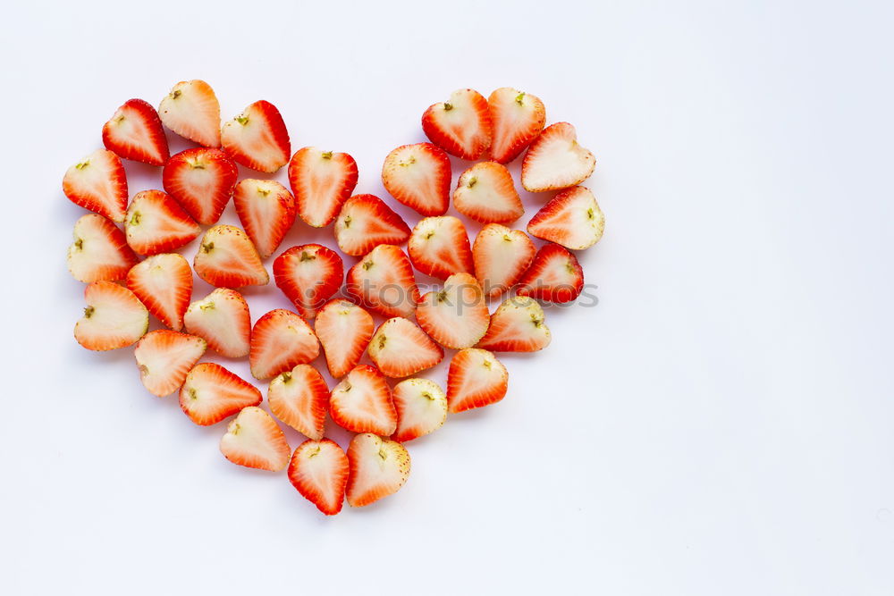 Similar – Image, Stock Photo Cut strawberries in heart form on turquoise blue