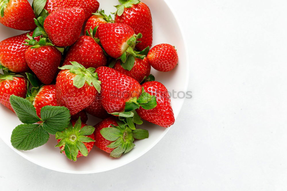 Similar – Strawberries in a bowl on a white wooden table