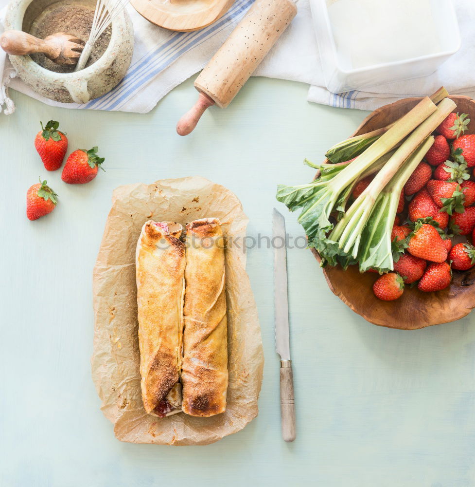 Similar – Image, Stock Photo Leaf of dough with rhubarb and strawberries