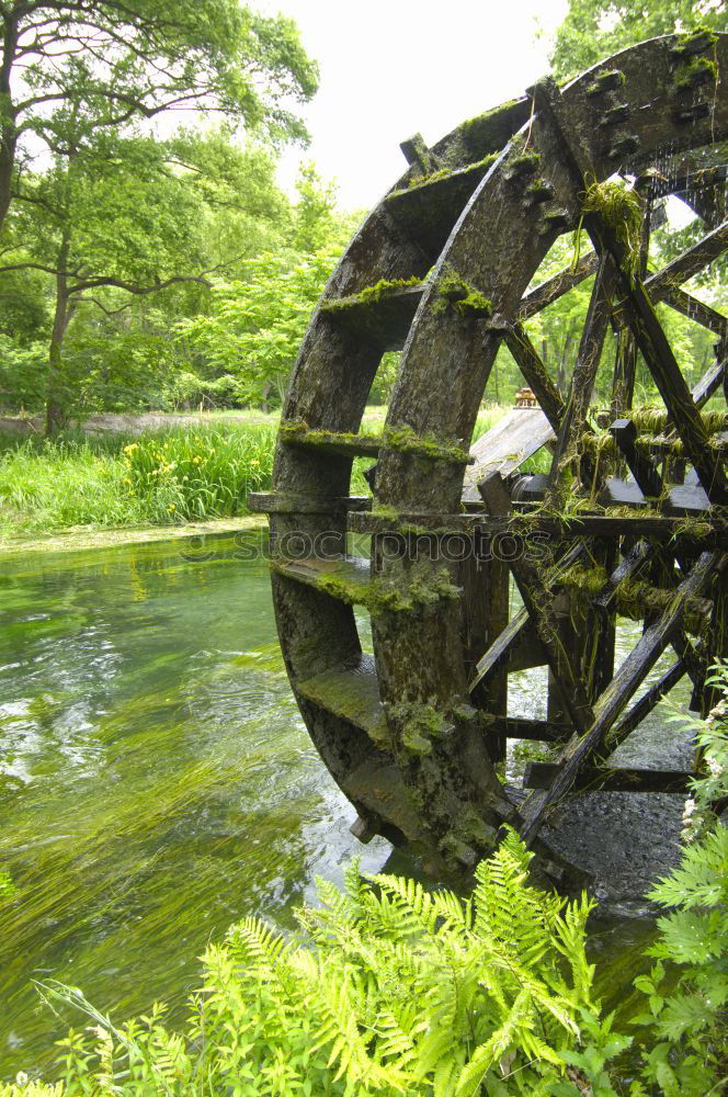 Similar – Image, Stock Photo Old mill wheel on rock with water channel