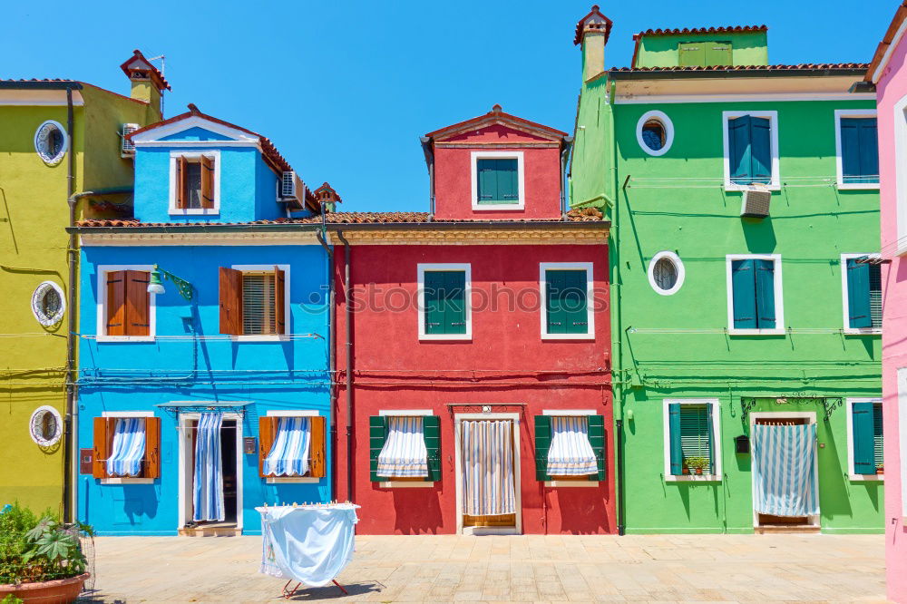Similar – Image, Stock Photo Hung laundry on the lines in front of houses in Burano.