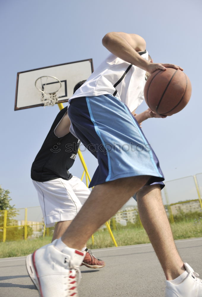 Similar – Image, Stock Photo Female basketball player stretching on sports ground