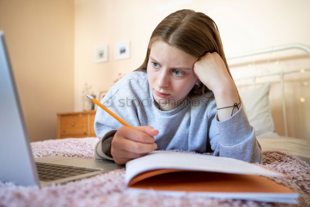 Similar – Image, Stock Photo Cute little girl lying on the carpet reading a book