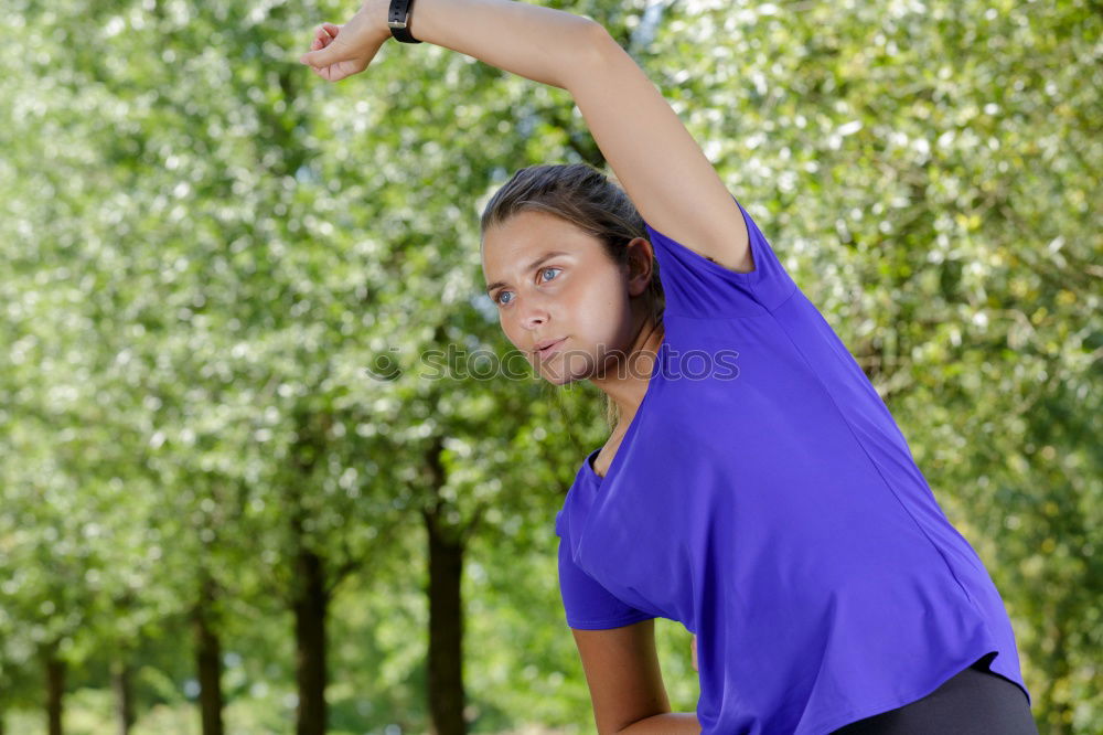 Similar – A beautiful young blonde woman stretching in a park