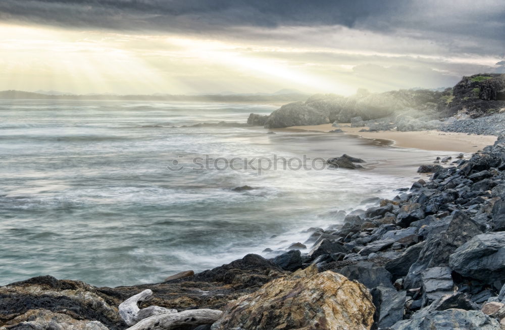 Similar – Image, Stock Photo Foaming surf on rocky coast, blue sky, clouds and high mountains in the background, Queensland / Australia . ,Lookout