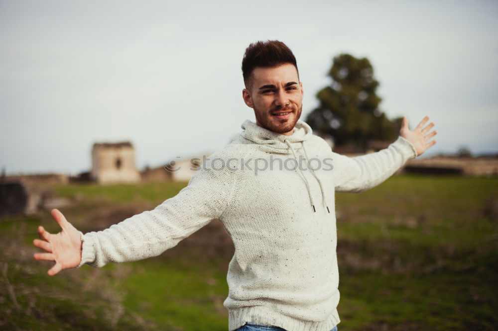 Similar – young man wearing suspenders in urban background