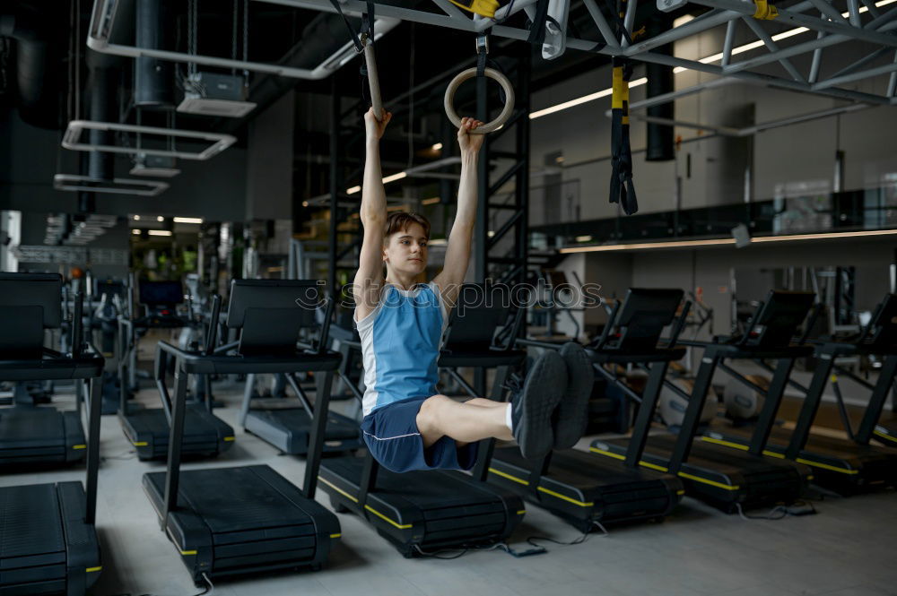 Similar – Image, Stock Photo Women training chins in gym in back image