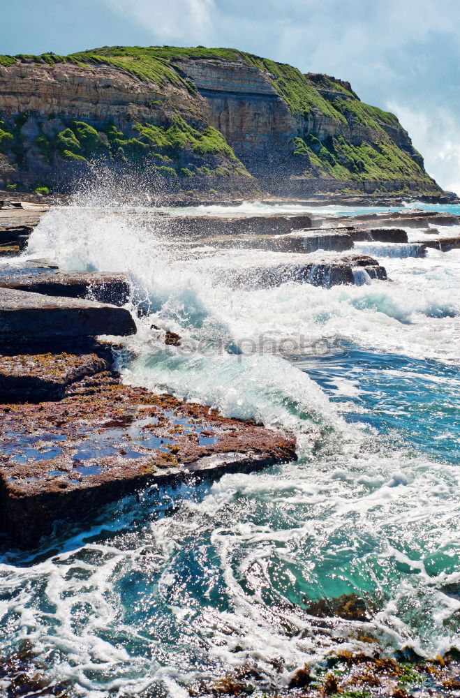 Similar – Woman sitting on cliff edge