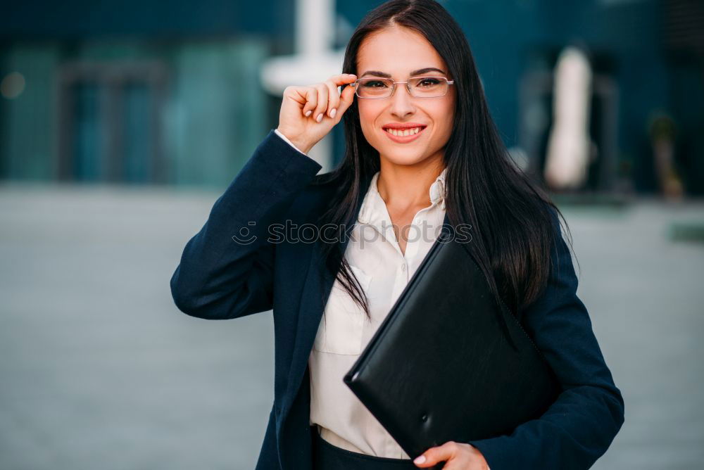 Similar – Image, Stock Photo Young businesswoman standing outside of office building