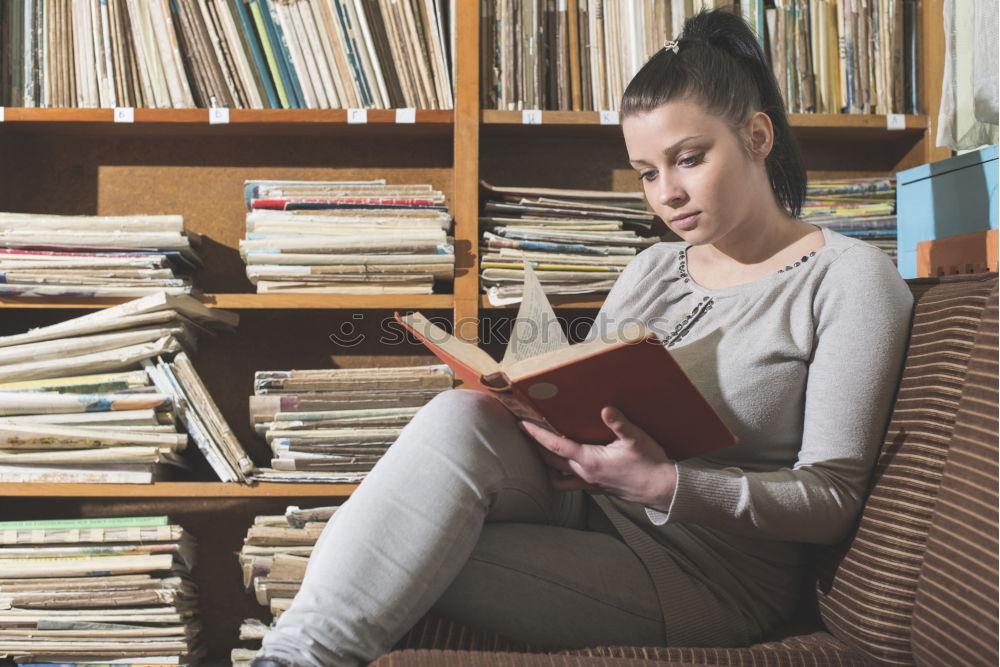 Similar – Student girl in a library