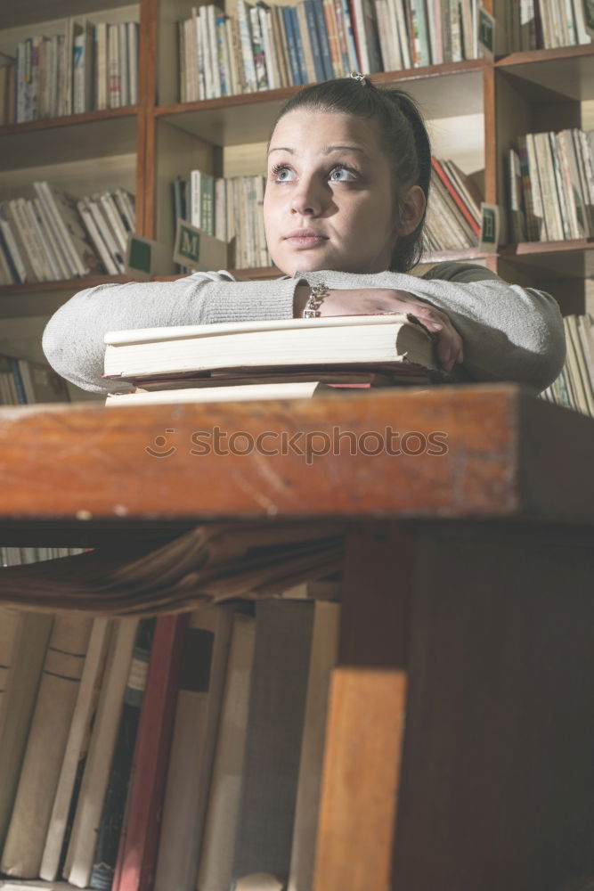 Similar – Student girl in a library