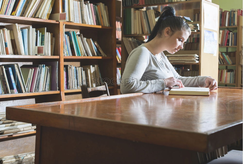 Similar – Student girl in a library