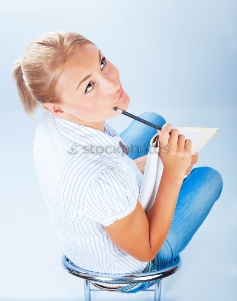 Similar – Image, Stock Photo Schoolgirl reading a book in classroom