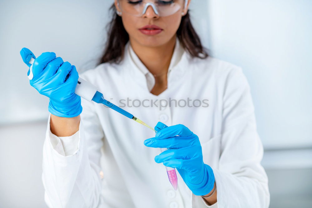 Similar – Image, Stock Photo Woman holding flask in lab