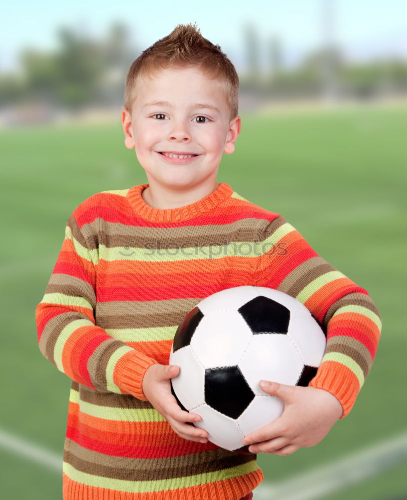 Similar – Portrait of a young boy with soccer ball. Concept of sport.