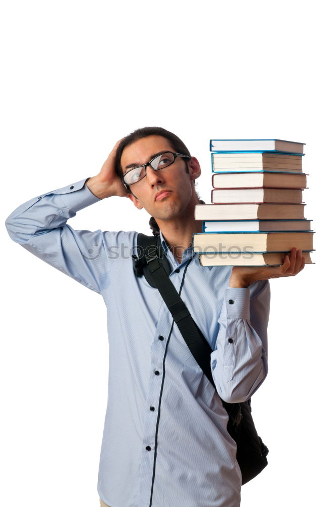 Similar – Man in book pile reading a book