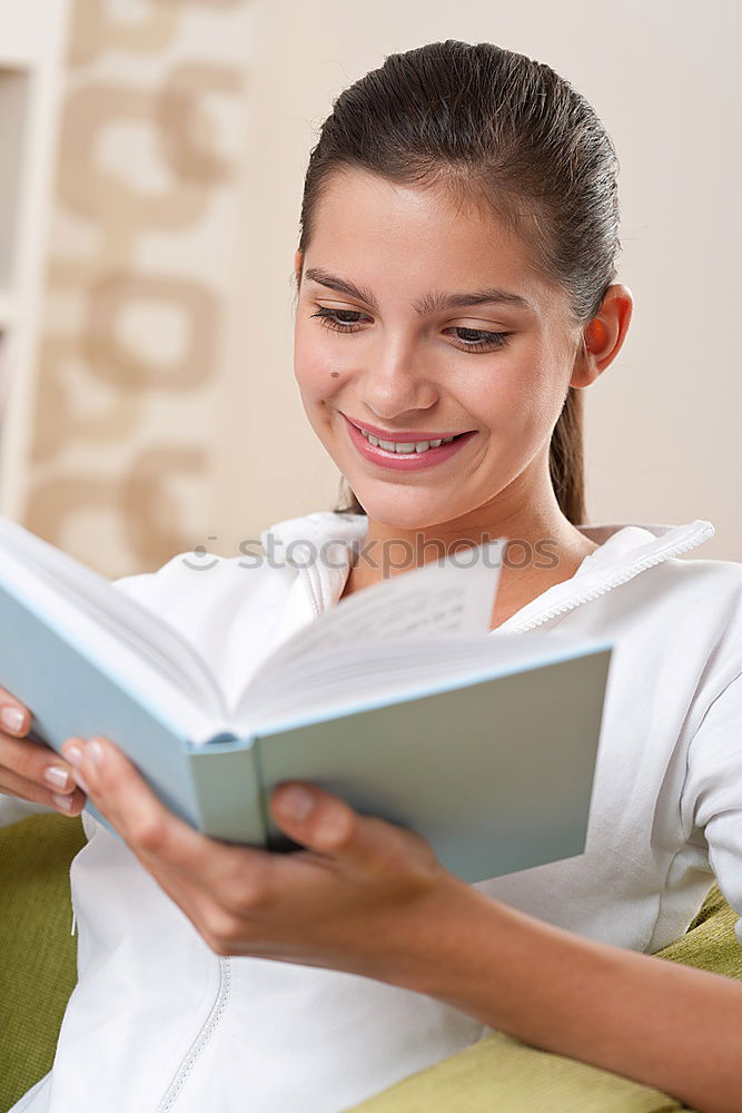 Similar – Image, Stock Photo Young woman in an apron looking up a recipe