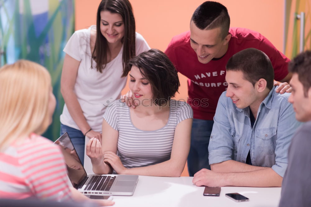 Similar – Image, Stock Photo Multi-ethnic group of young people looking at a tablet computer outdoors