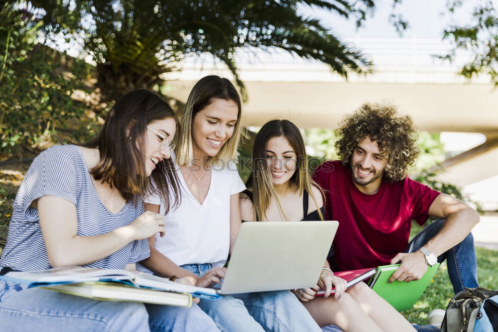 Similar – Image, Stock Photo Multi-ethnic group of young people looking at a tablet computer outdoors