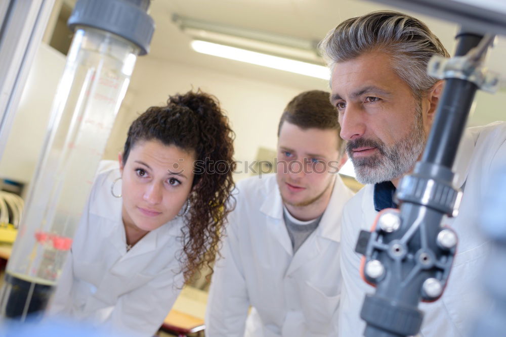 Similar – Image, Stock Photo Workers communicating in lab
