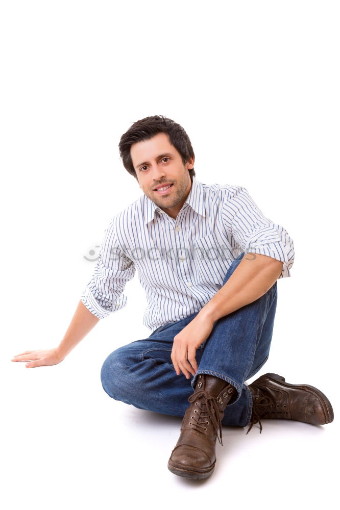 Similar – Young man sitting on the floor in urban background