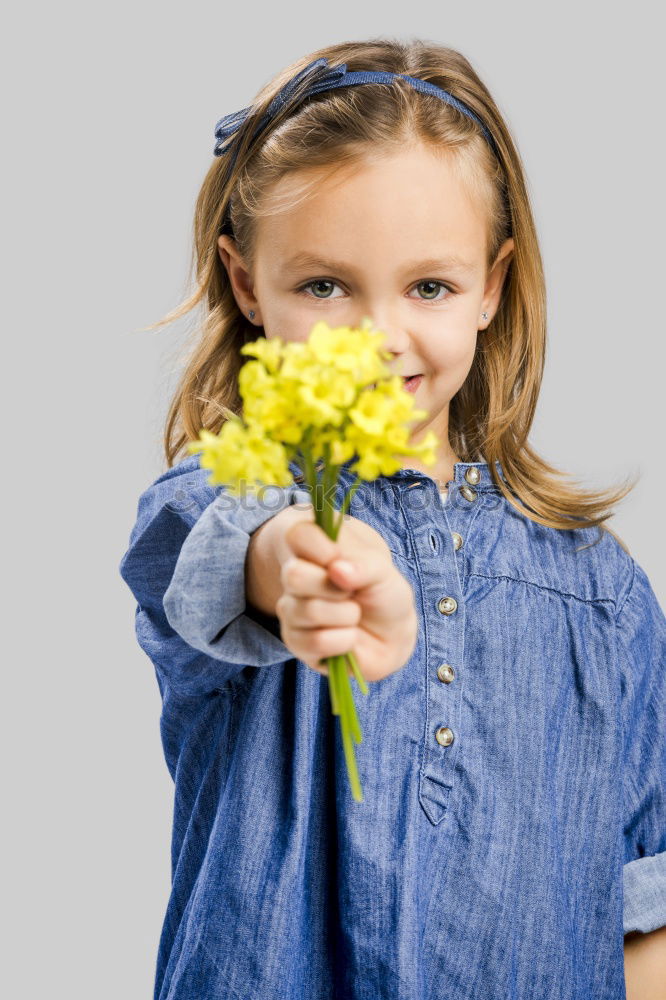 Similar – romantic portrait of happy child girl picking bouquet of beautiful blue delphinium flowers from summer garden