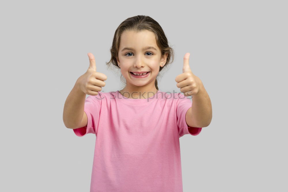 Similar – A kid holding a happy emoticon face