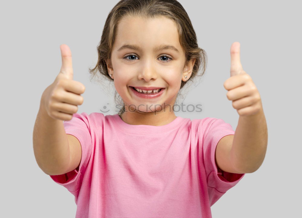 Similar – A kid holding a happy emoticon face