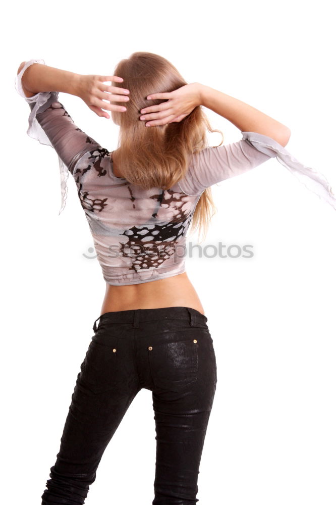 Similar – Image, Stock Photo Young, athletic, slender woman stands sideways in front of a white wall with her head bent forward so that her long brunette hair hangs down in front of her face