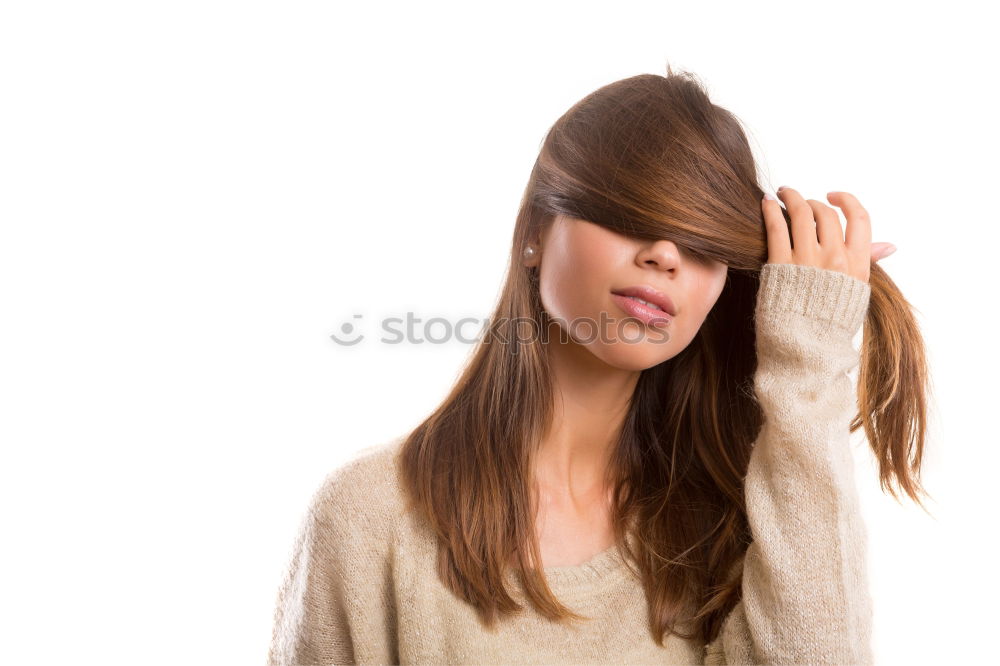 Similar – Portrait of a dark blond, long-haired woman looking into the camera through the hair on her face